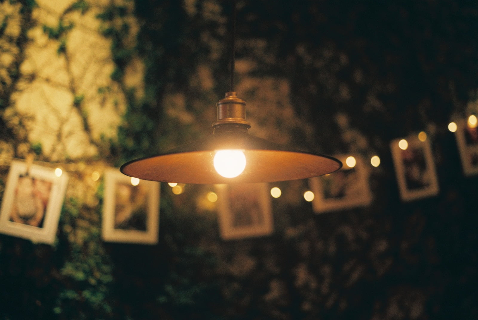 a night safe light black pendant lamp turned on during nighttime