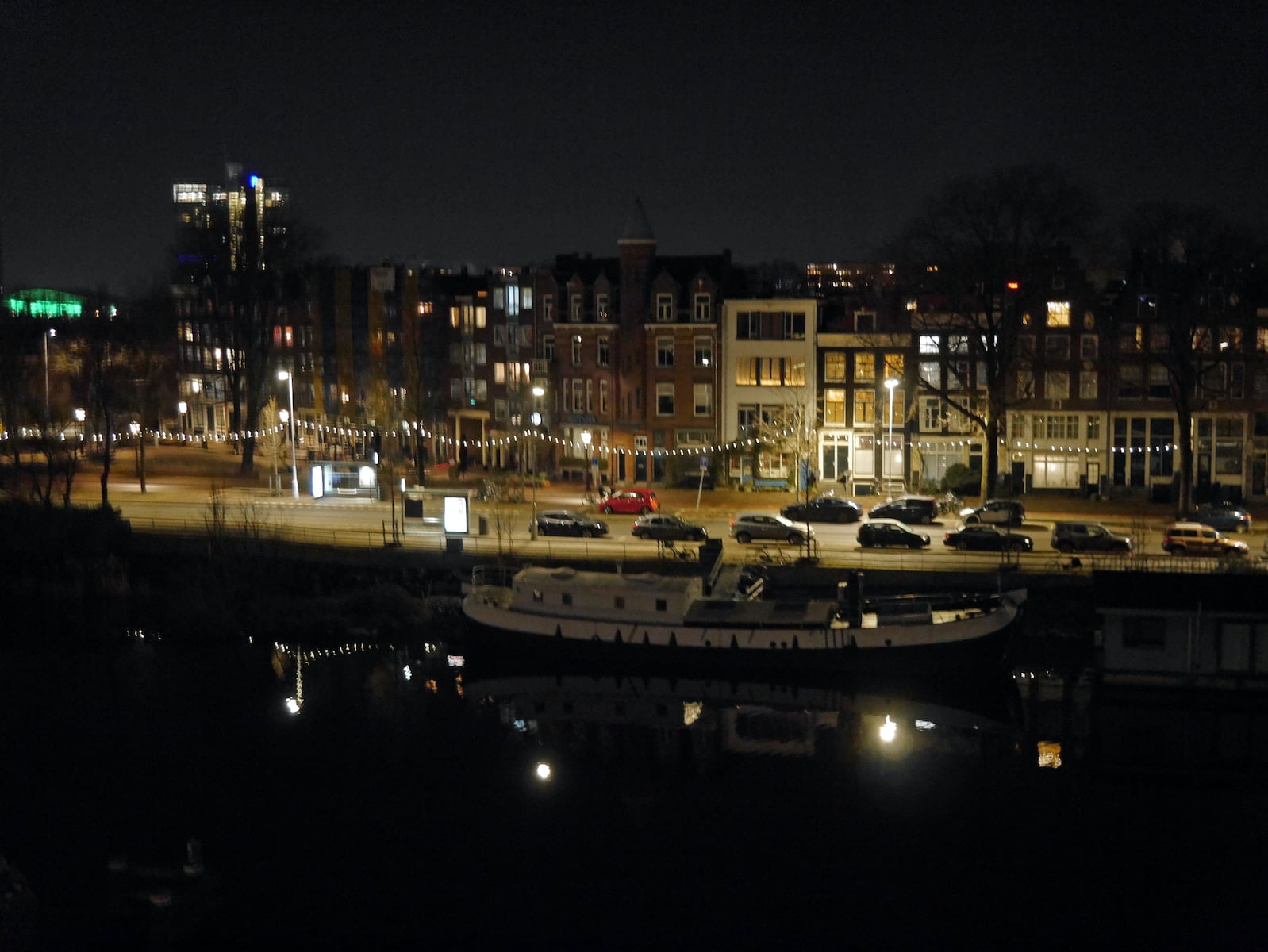 white and black boat on dock during night time